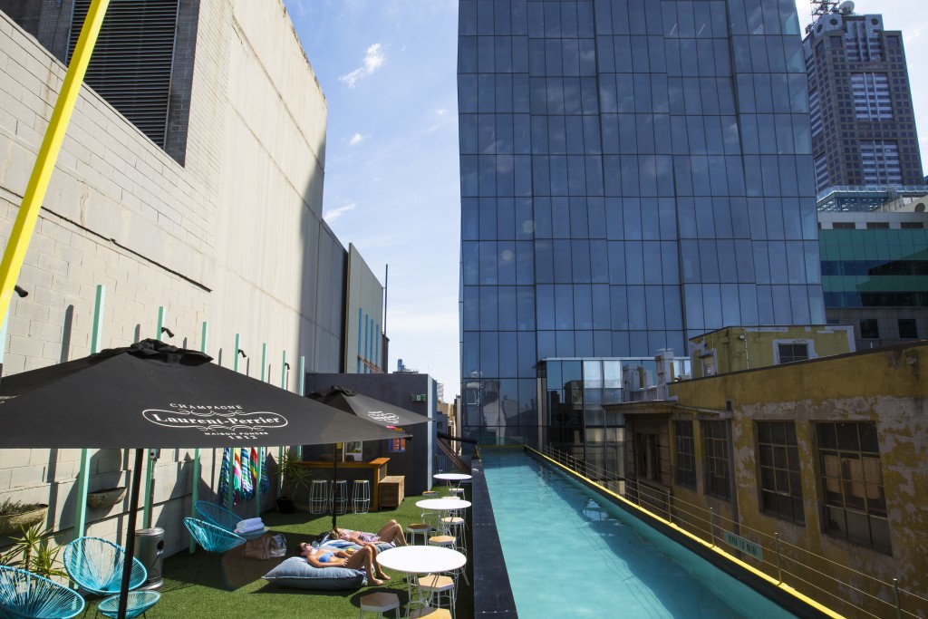 Guests relax by the rooftop pool at the Adelphi Hotel, Fliners Lane, Melbourne
