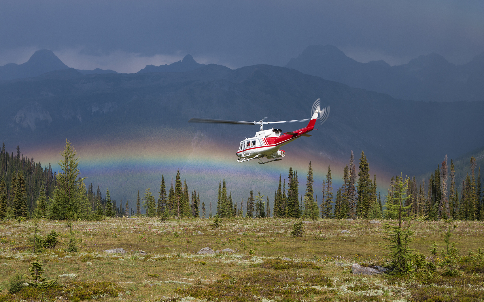 Helicopter flying into Rainbow in Silver Basin