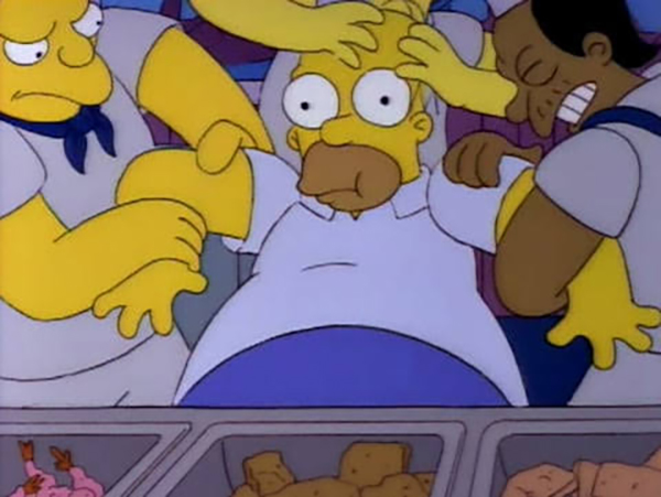 A screenshot from The Simpsons of Homer being dragged away from a buffet