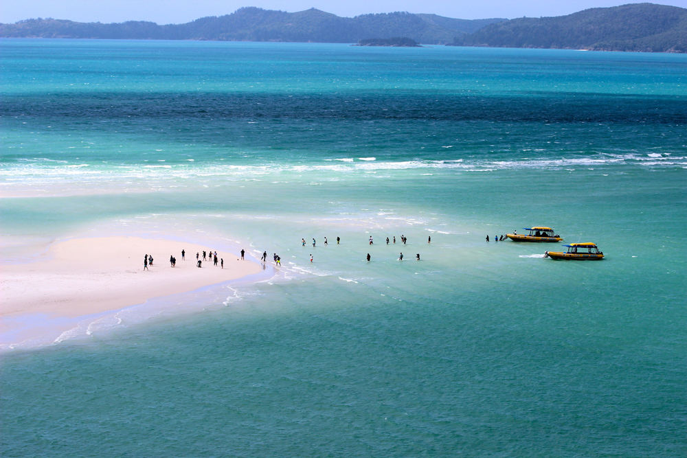 Whitehaven Beach sandbars can be explored while camping in Whitsundays, Australia
