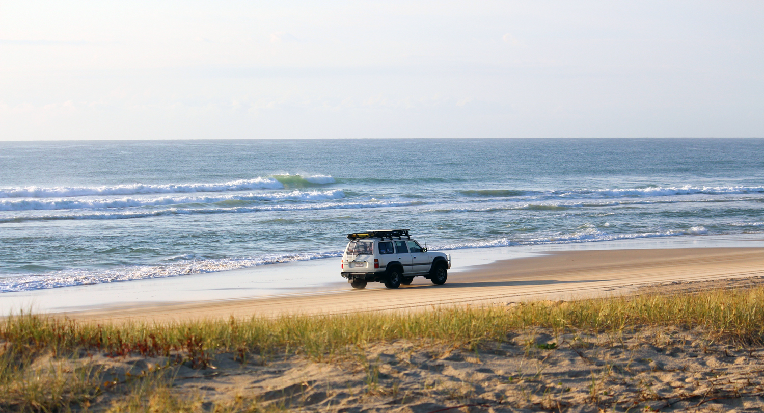 4WD on Fraser Island beach, 150km north of the Sunshine Coast, Queensland, Australia