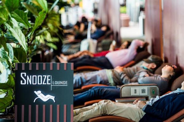 People sleep in the Singapore Airport Snooze Lounge