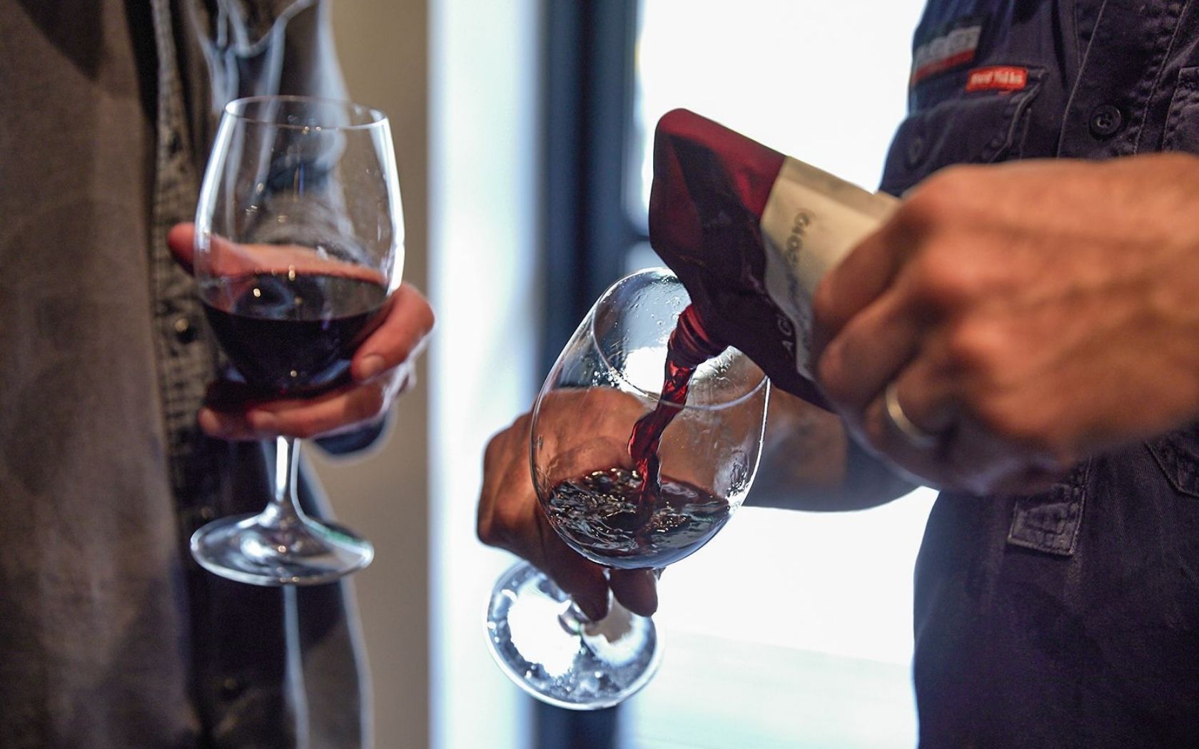 a glass off mini goon sacks australian wine service